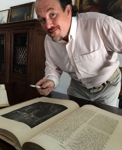 Franco Vassallo with one of his many antique copies of The Divine Comedy Franco Vassallo with one of his many antique copies of The Divine Comedy